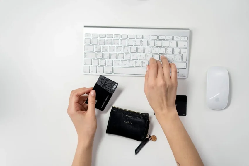 woman holding visa card typing woman holding visa card typing