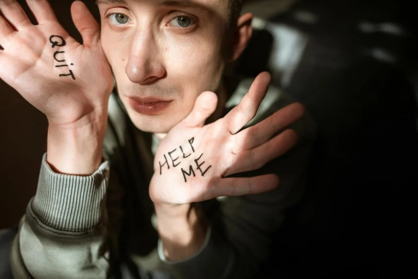 man with quit and help me on hands